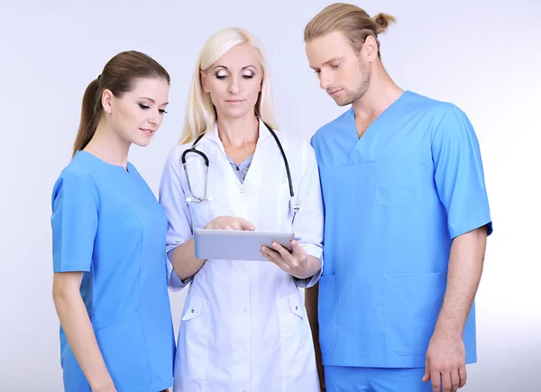 Medical workers on grey background