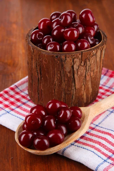 Sweet cherry in wooden basket on table close-up