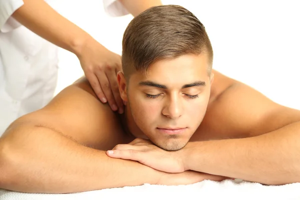 Young man having back massage close up