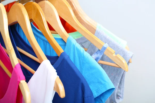 Clothes on circle hanger on light background