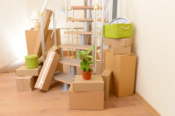 Stack of cartons near stairs: moving house concept