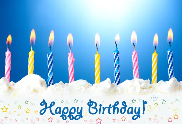 Beautiful birthday candles on blue background