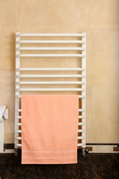 Color towel on radiator in bathroom