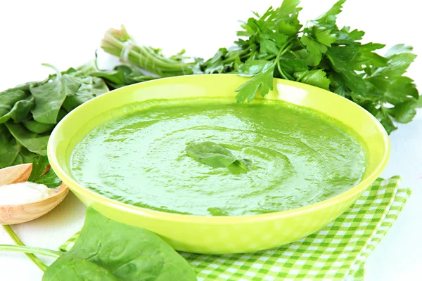 Tasty spinach soup, on white table