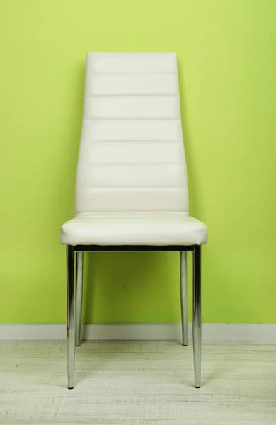 Modern color chair in empty room on wall background