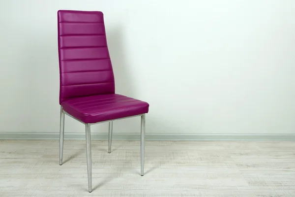 Modern color chair in empty room on wall background