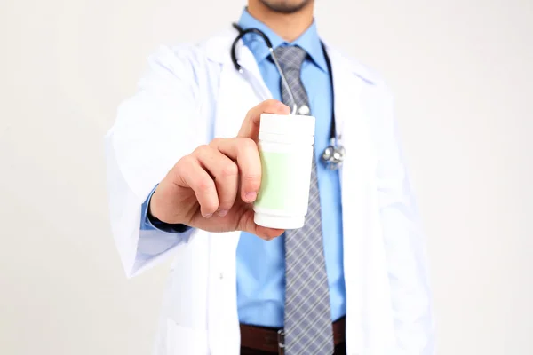 Male Doctor with pills, close-up