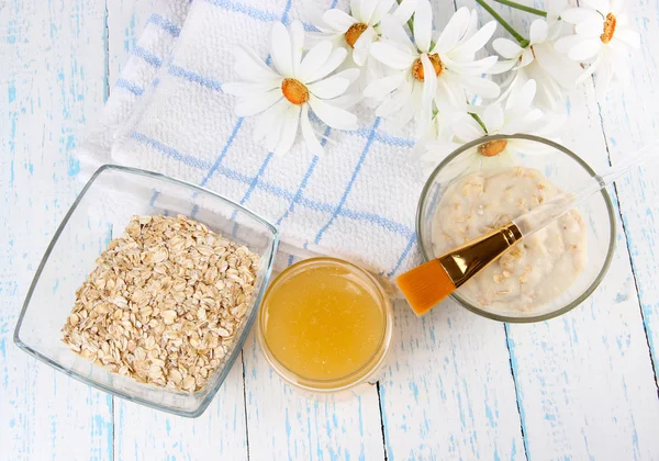 Homemade facial masks with natural ingredients, on color wooden background