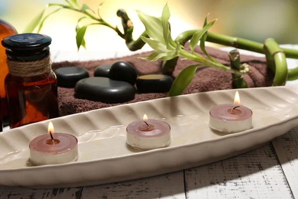 Beautiful spa setting with bamboo on bright background