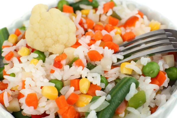 Cooked rice with vegetables close up