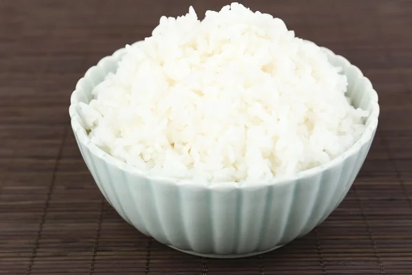 Cooked rice on bamboo background