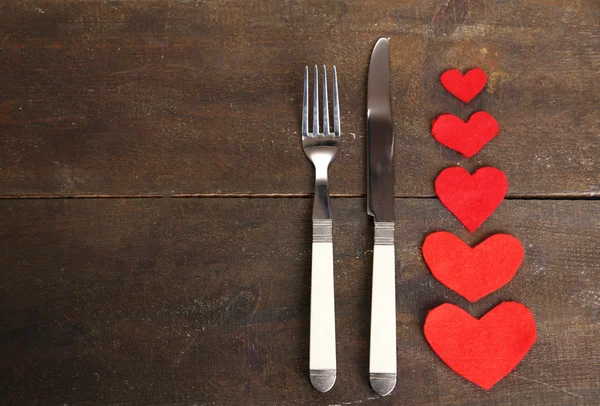 Valentines day dinner with table setting on wooden table close-up