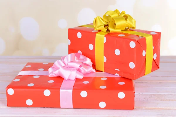 Gift boxes on table on light background