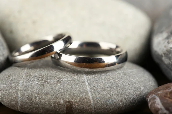 Wedding rings on rocks close-up