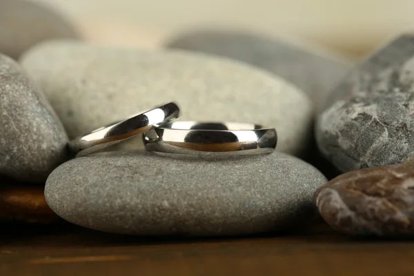 Wedding rings on rocks close-up