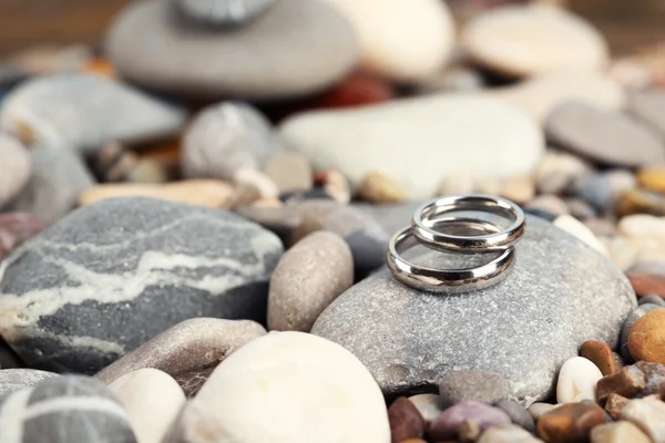 Wedding rings on rocks close-up