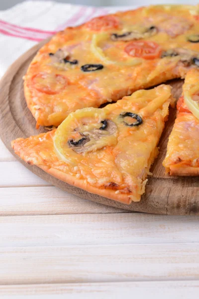 Tasty pizza on table close-up