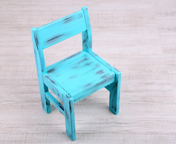 Blue old wooden chair on wooden floor