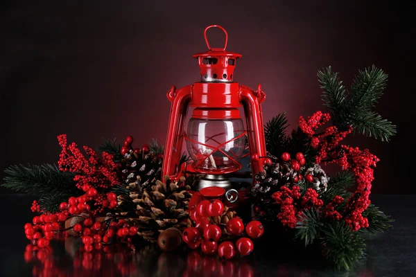 Red kerosene lamp on dark color background