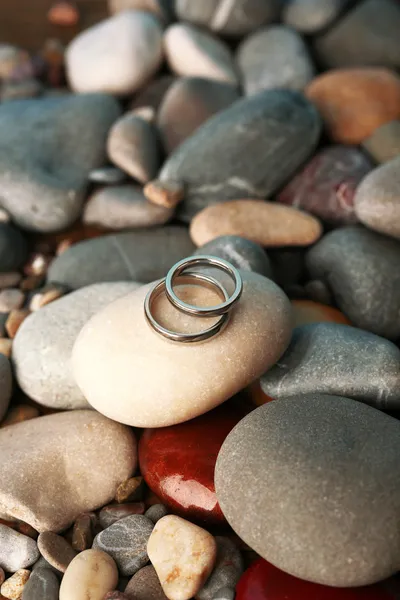 Wedding rings on rocks close-up