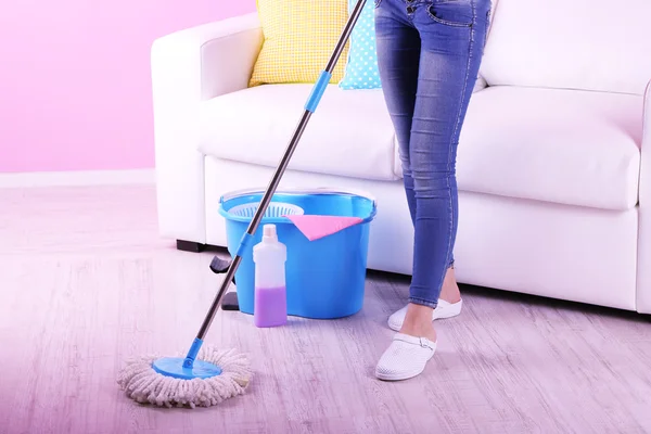 Cleaning floor in room close-up