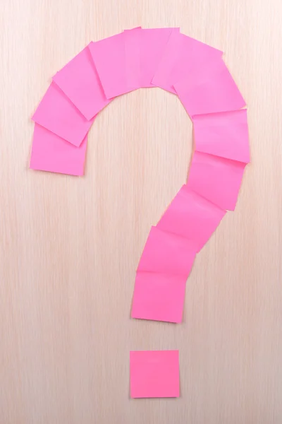 Question mark made of adhesive note close-up