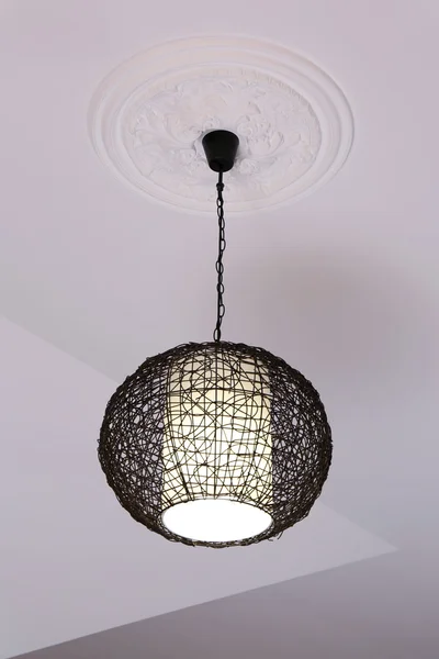 Modern chandelier hanging from ceiling