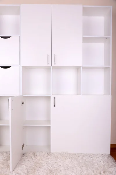 Empty white shelves close up