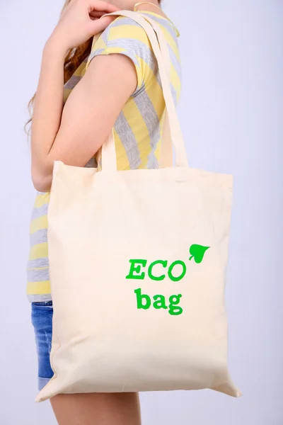 Woman with eco bag, isolated on white