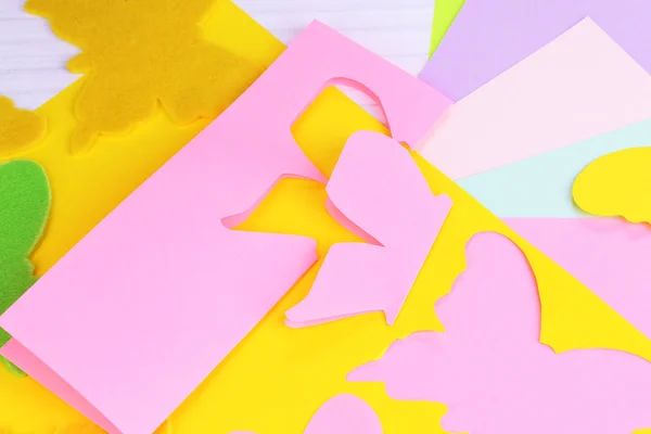 Women hand cutting colorful paper with scissors