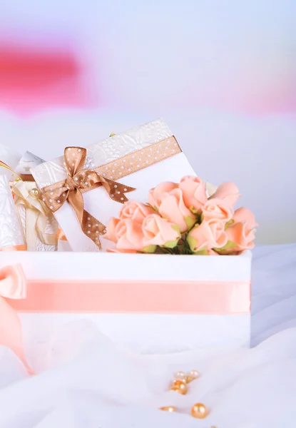 Beautiful handmade wedding cards in box, on light background