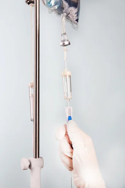 Disposable infusion set on blue background