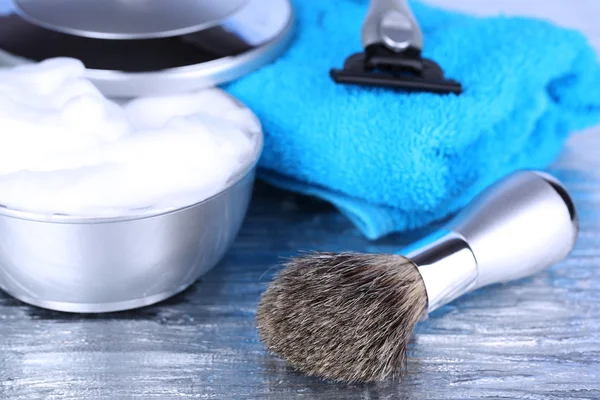 Male luxury shaving kit with towel on gray background