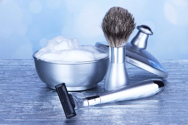 Male luxury shaving kit on table on bright background