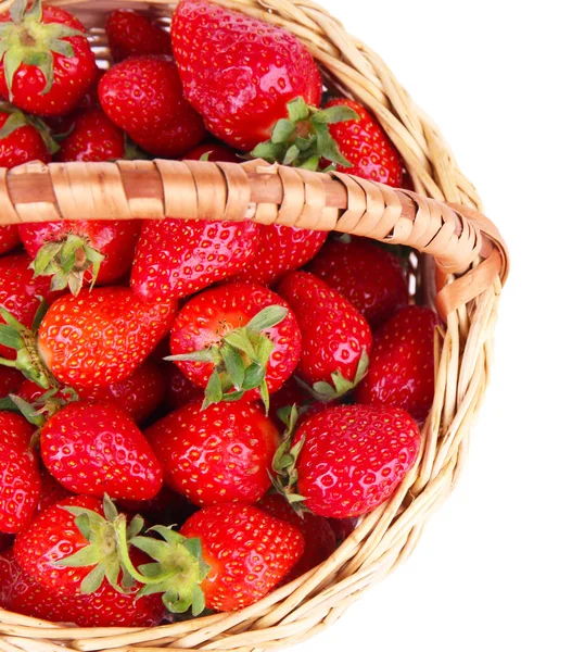 Ripe sweet strawberries in wicker basket, isolated on white