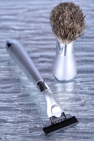 Shaving accessories on gray background