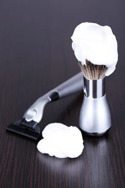 Shaving accessories on wooden background