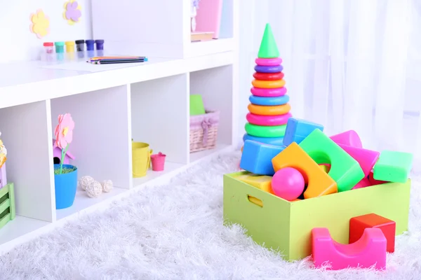 Colorful plastic toys in children room