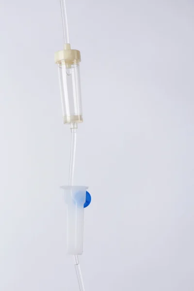 Disposable infusion set on grey background