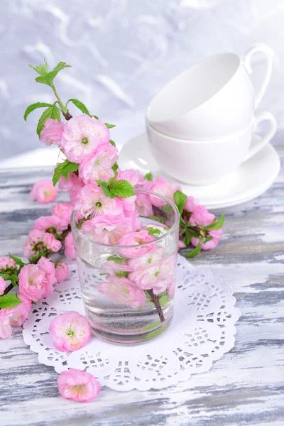 Beautiful fruit blossom in glass on table
