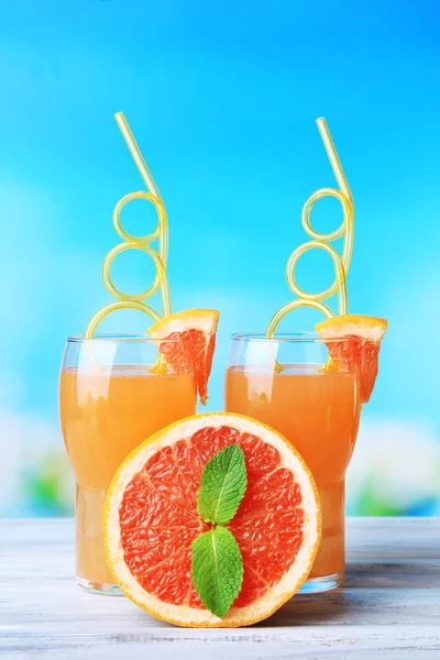 Grapefruit cocktail with cocktail straw