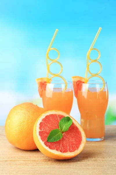 Grapefruit cocktail with cocktail straw