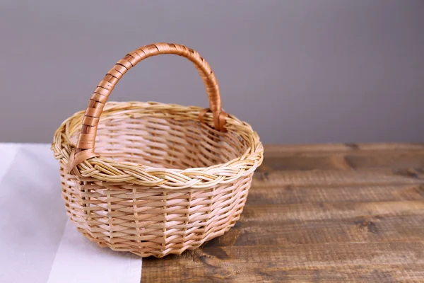 Empty wicker basket on wooden table