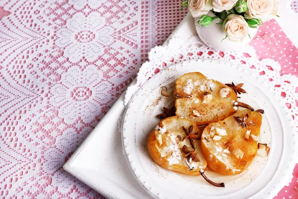 Baked pears with syrup on plate