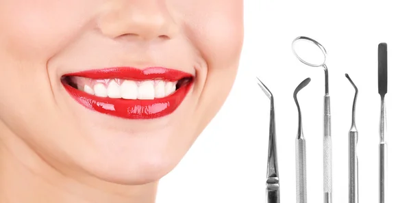 Healthy teeth and dental tools.