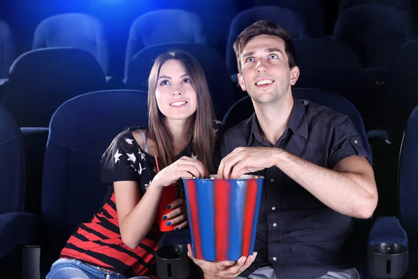 Couple watching movie in cinema