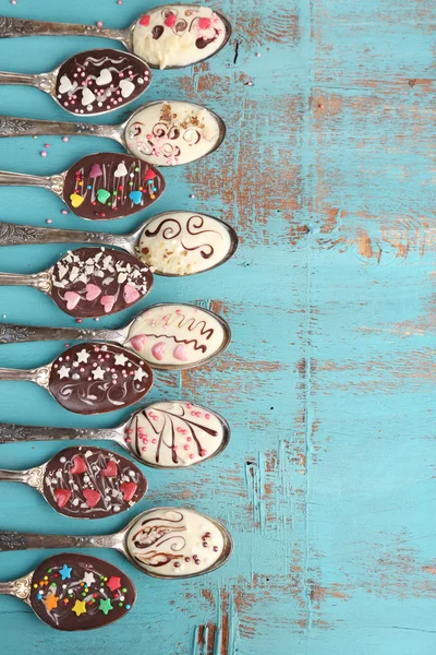 Spoons with tasty chocolate
