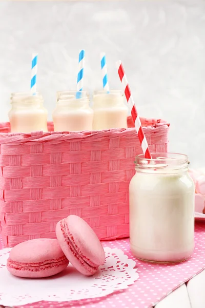 Milk in bottles with paper straws