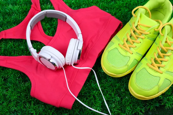 Sport clothes, shoes and headphones