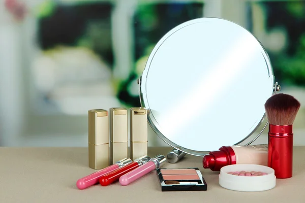 Round table mirror with cosmetics